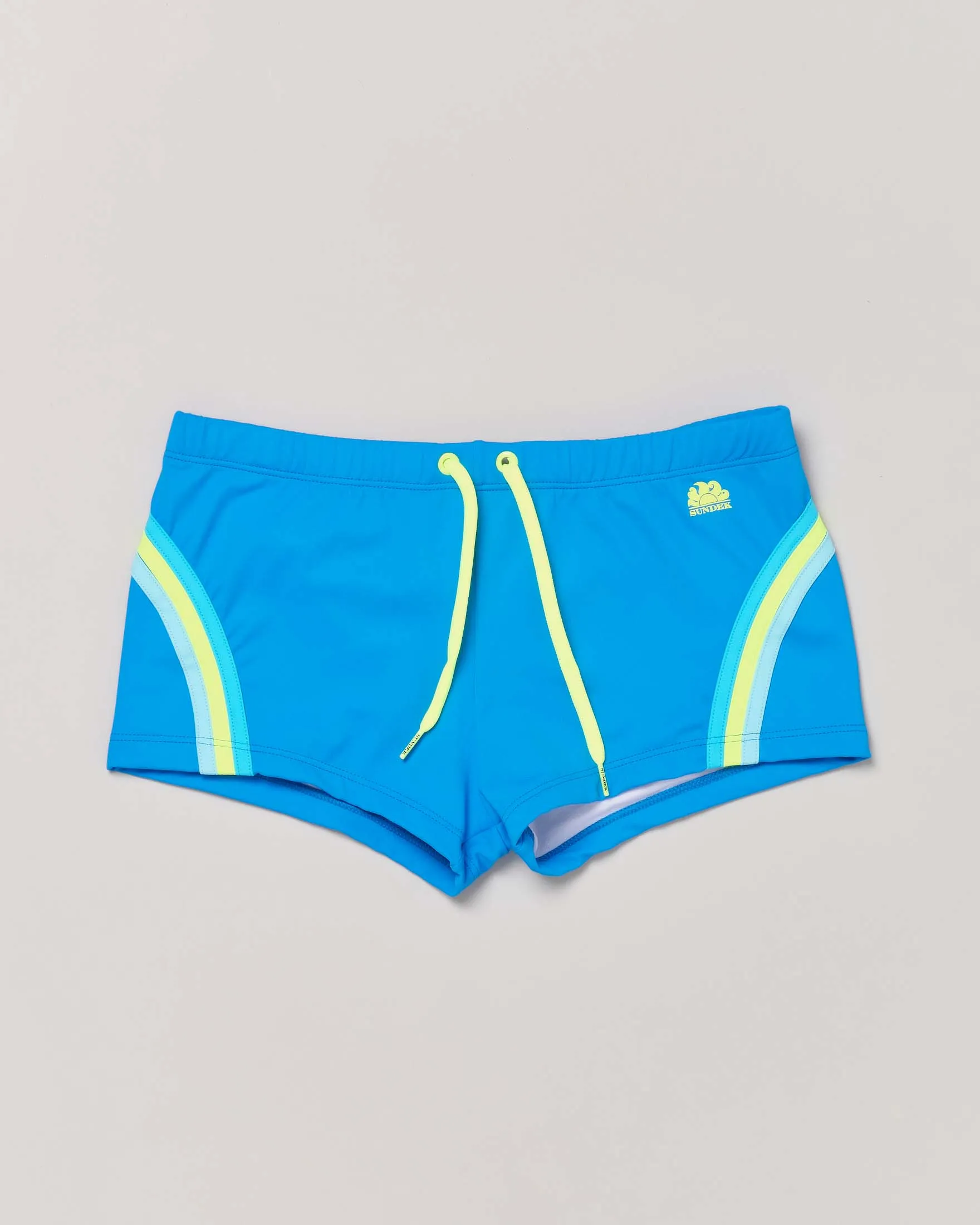Costume parigamba turchese in tessuto tecnico stretch con arcobaleno celeste giallo e azzurro 6-14 anni