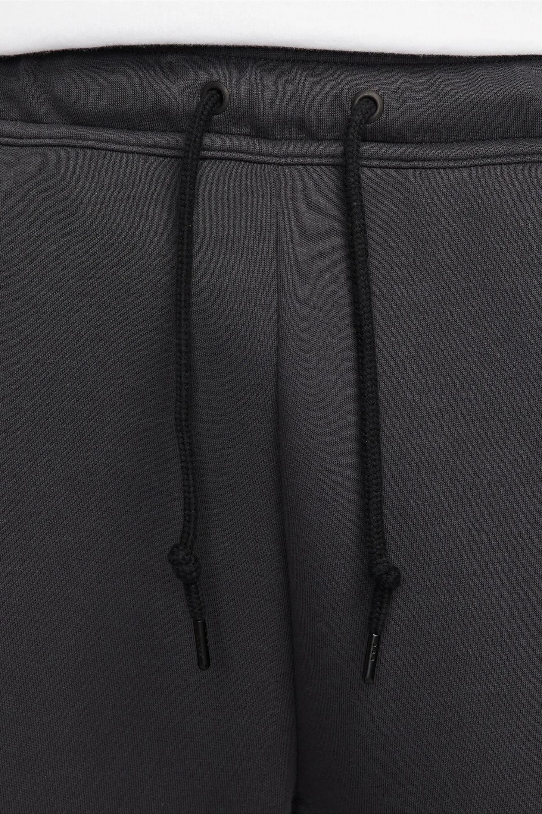 Nike - Pantaloni da jogging in tessuto tecnico e pile