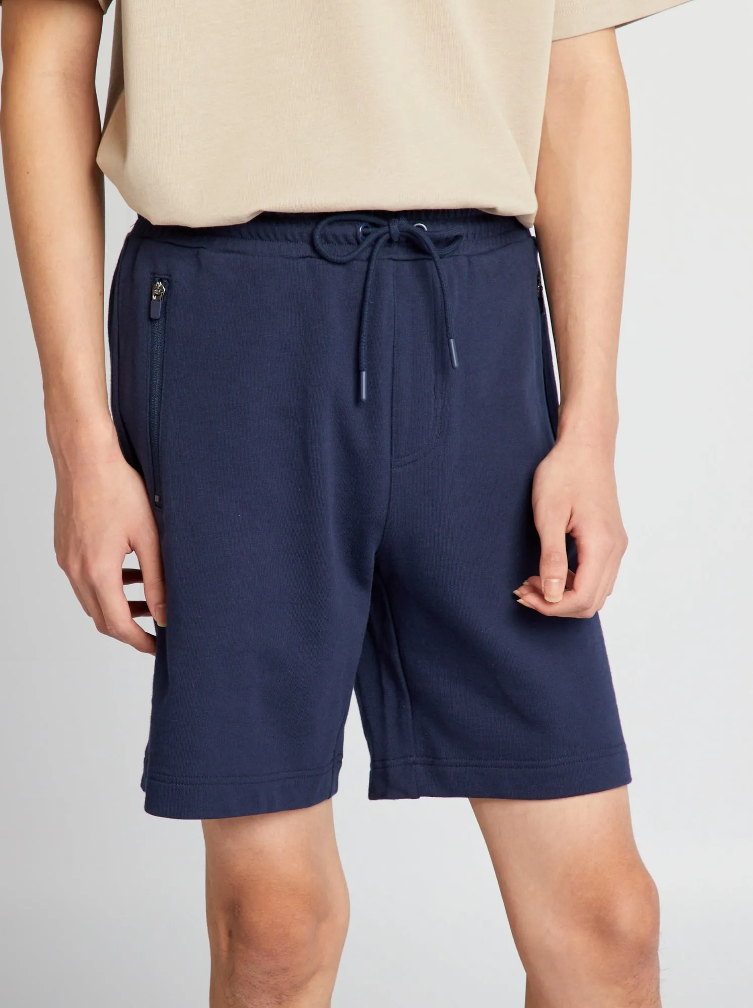 Shorts in tessuto felpato con tasche con zip - NERO